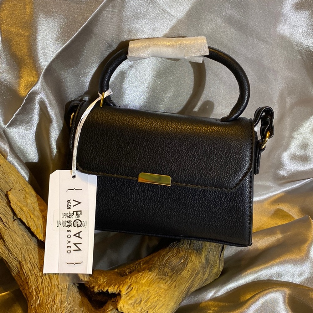 Park Ave Collection black with gold tone hardware. Magnetic snap closure.